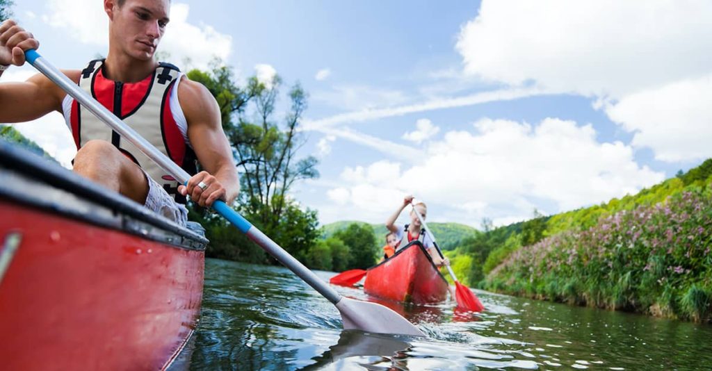 canoeing is family friendly. photo of two people in separate canoe