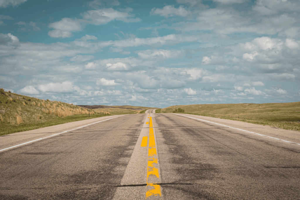 a photo of a two lane highway in Nebraska. perfect for a road trip or car camping tour.